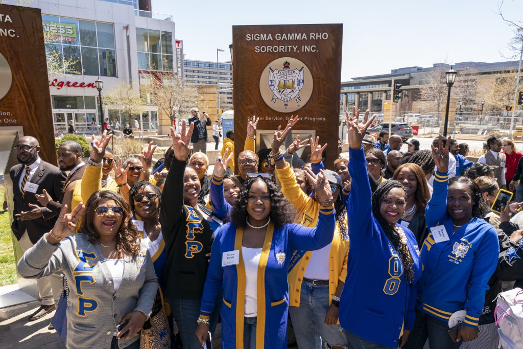 Members of Sigma Gamma Rho Sorority in front of their Sign