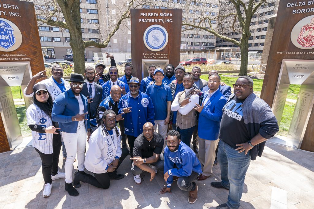 Members of Phi Beta Sigma Fraternity in front of their Sign